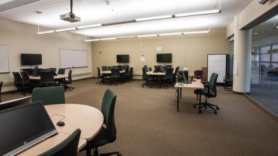 Open lab with small circular tables for collaboration