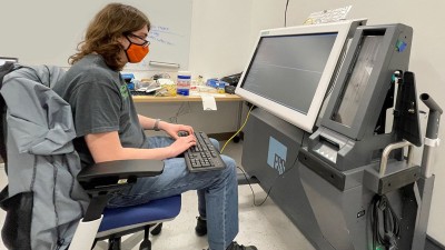 Student working on Voting Machine Project.