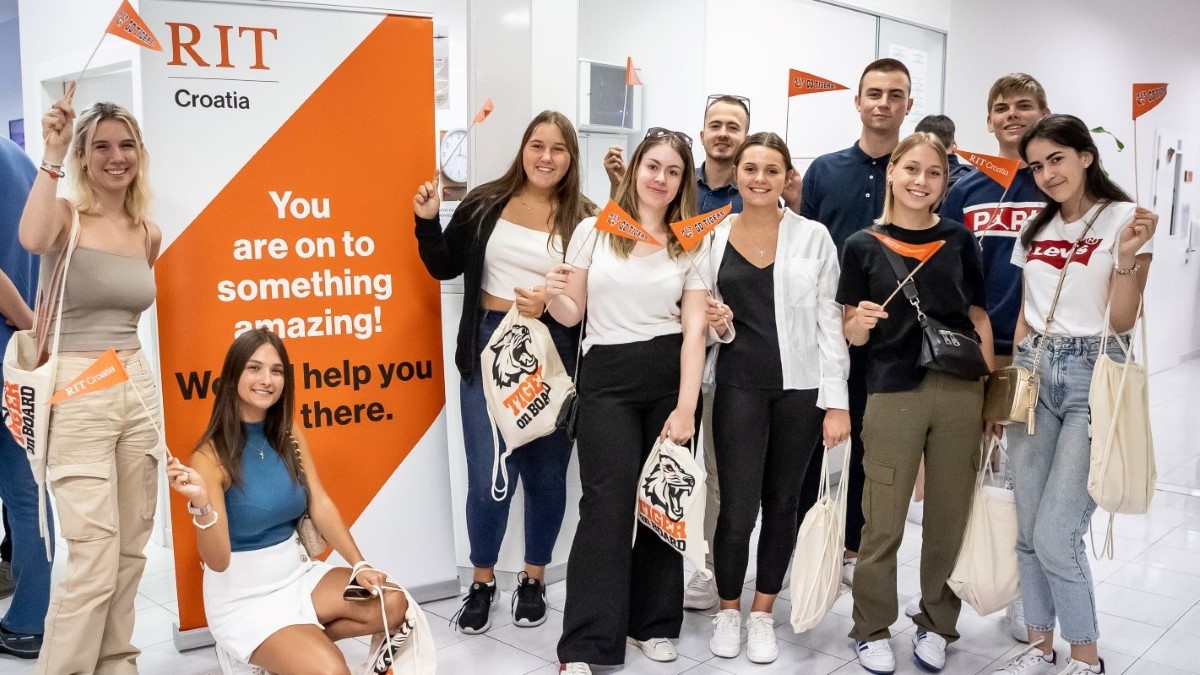 Students waiving with RIT Croatia flags