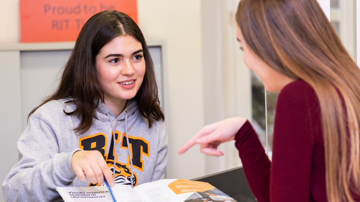 Student s at the Student Services reception desk