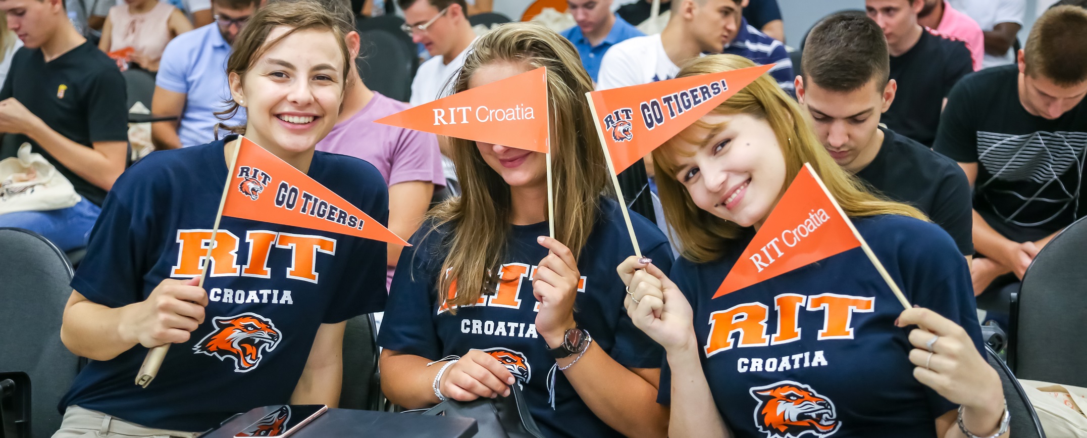 Students with flags at the Orientation