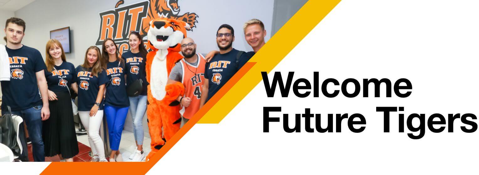RIT Students standing with RITchie in front of an RIT logo
