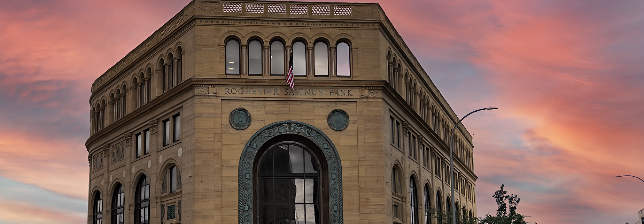 Rochester Savings Bank Exterior shot with beautiful sunset background.