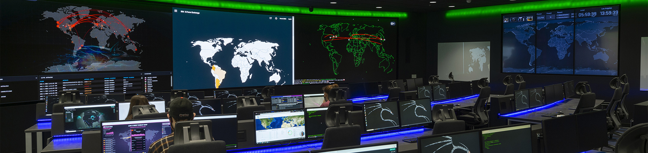 Cybersecurity room with monitoring equipment and displays.