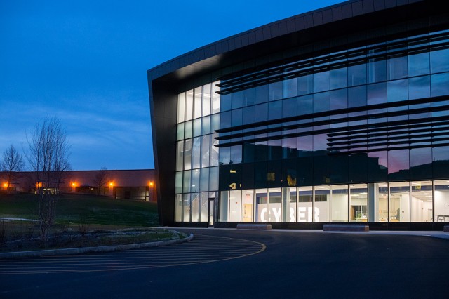 exterior of glass building at dusk.