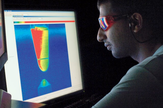 student looking at cone-shaped image of data.