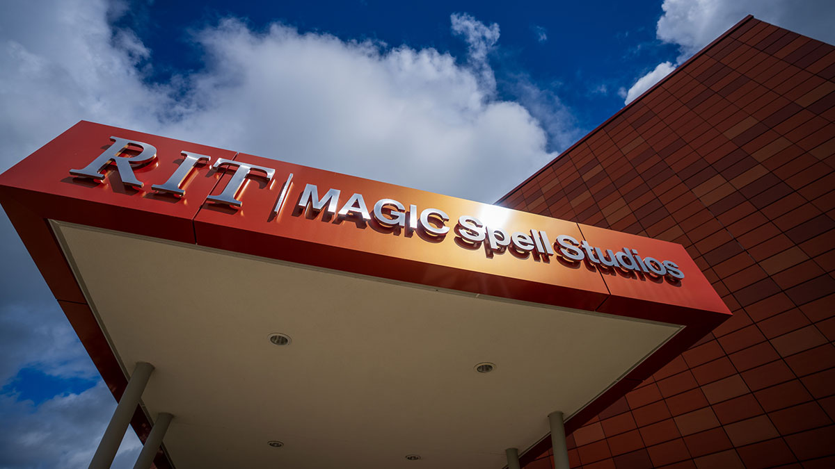 building marquee with signage for R I T Magic Spell Studios.