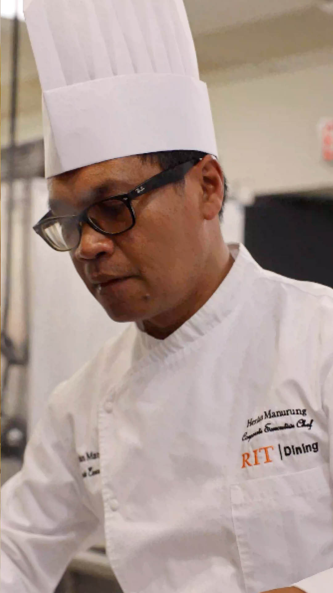 herlan mangru in chef hat cooking