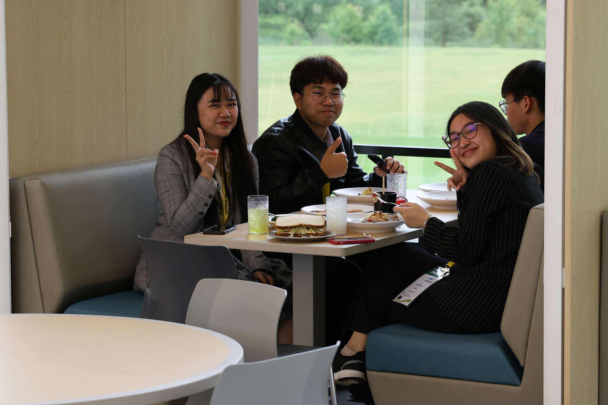 four students eating in a booth