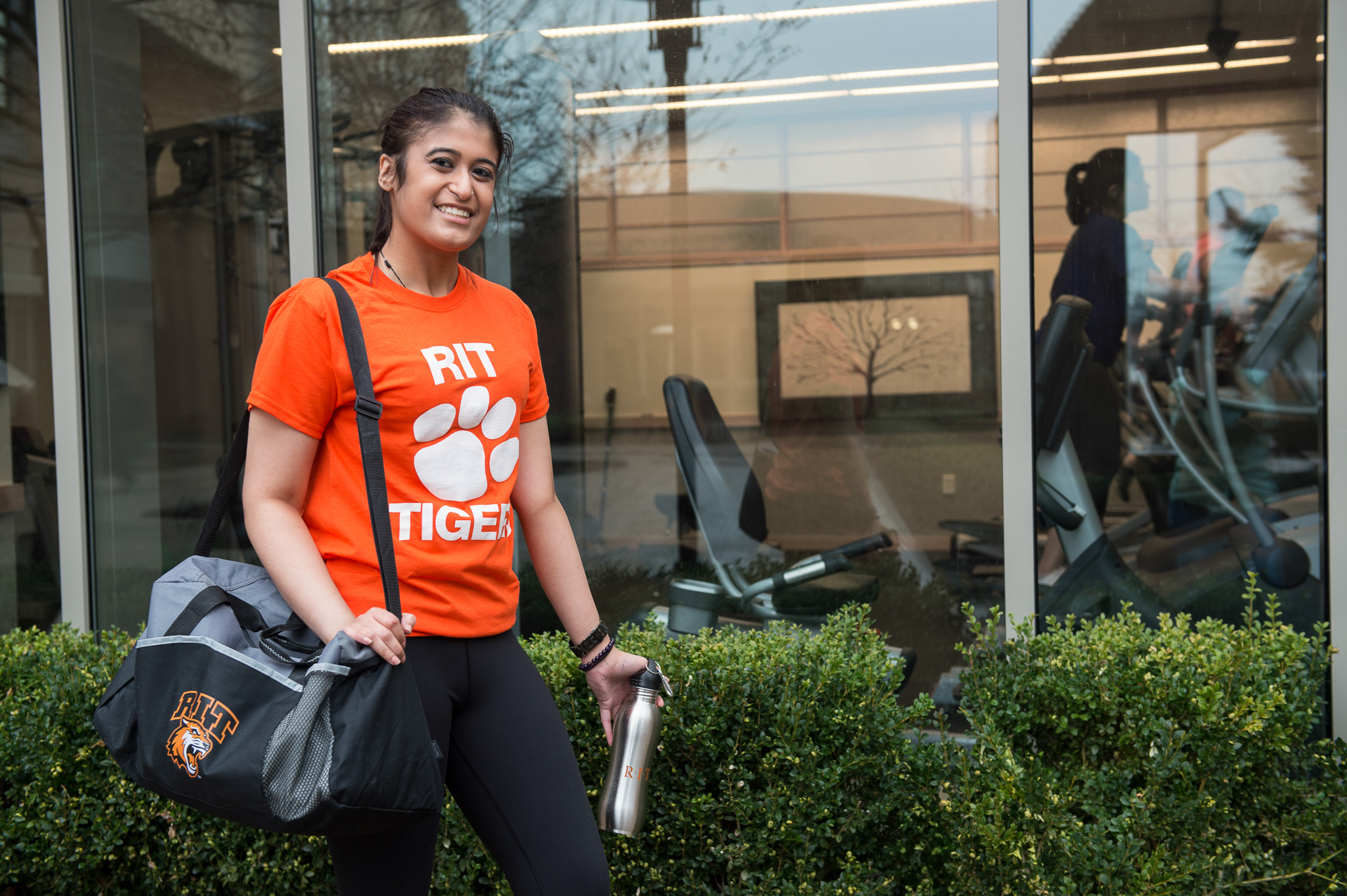 student walking into gym
