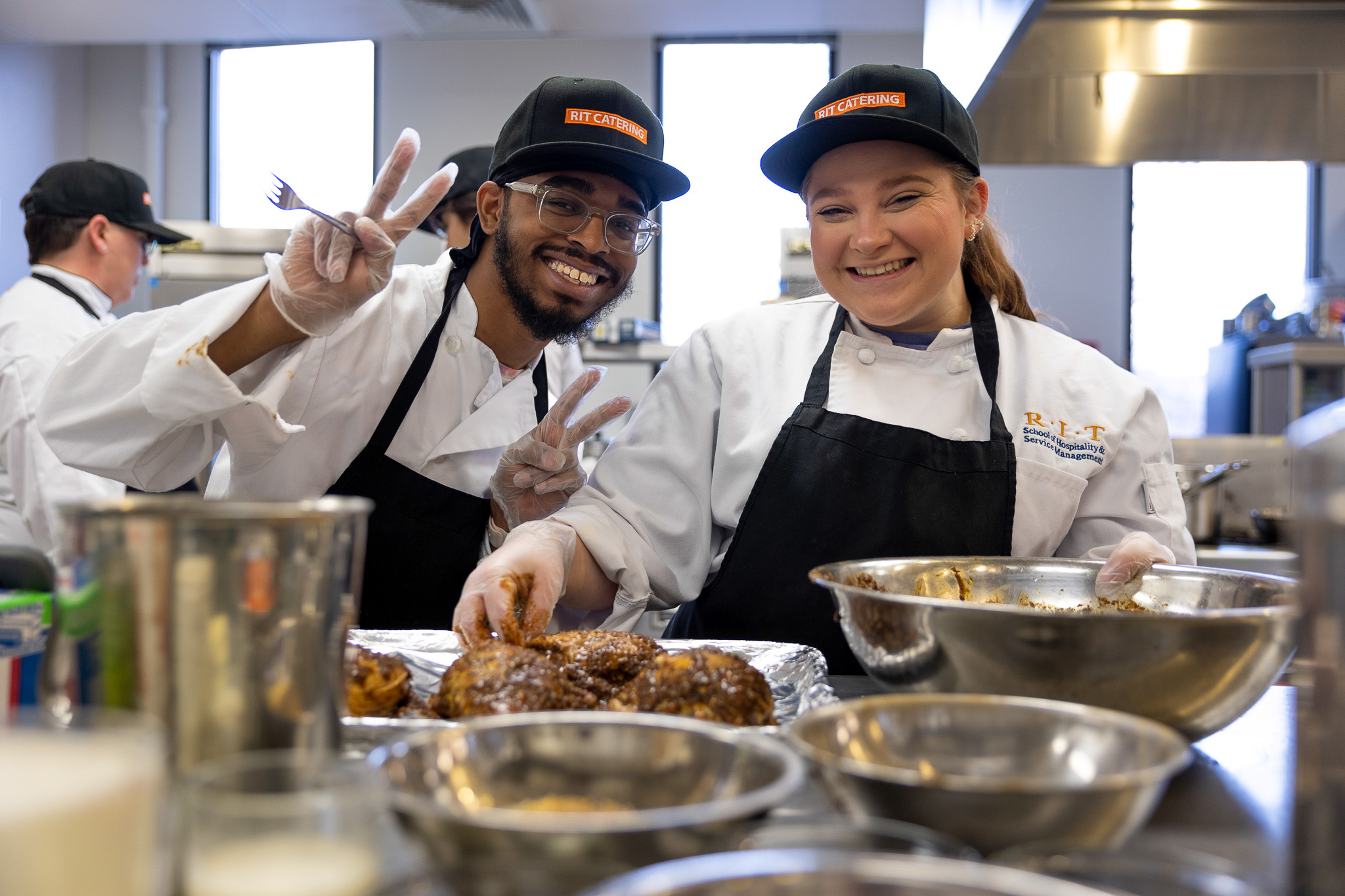 students with chef apron smiling