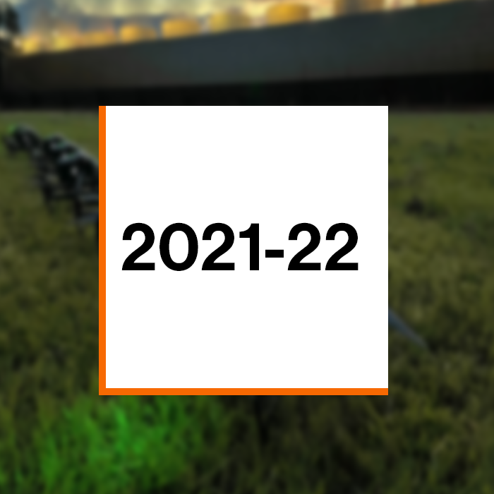 Annual Report 2021-22 cover photo: Photo of large drones landed on the ground near the exhaust towers of a powerplant