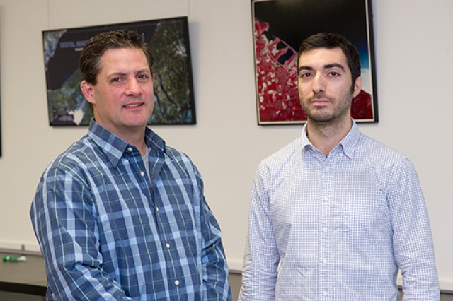 Two people posing for camera