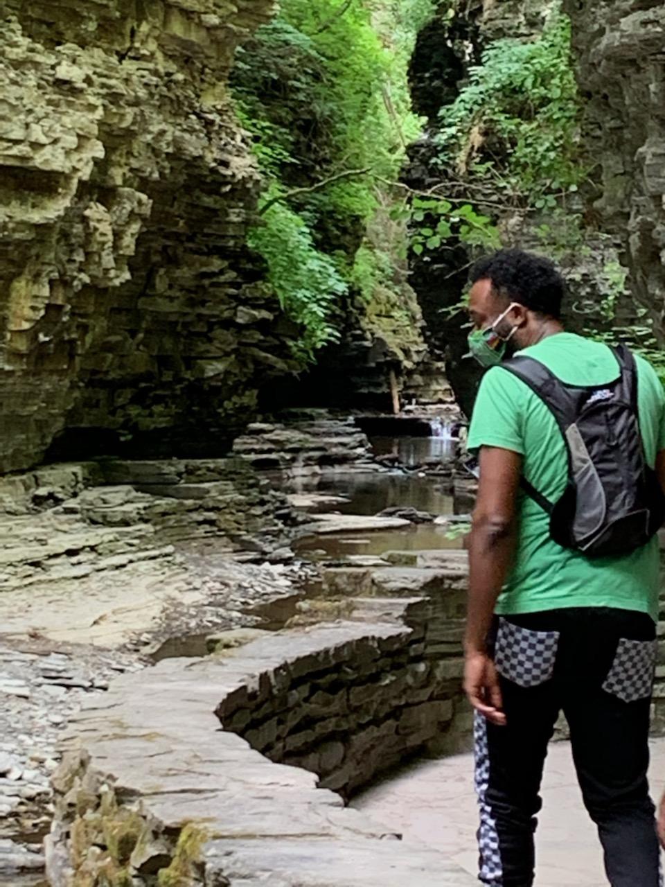 Taj standing on trail next to water