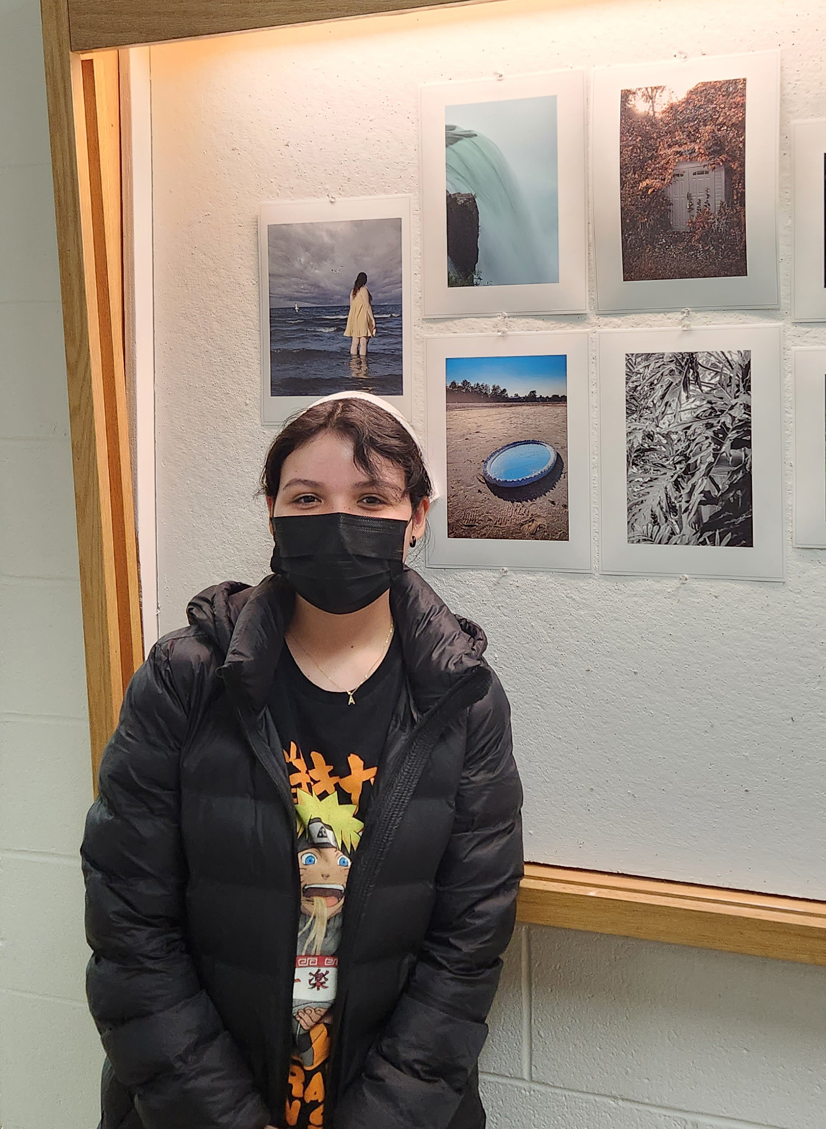 student standing in front of display case