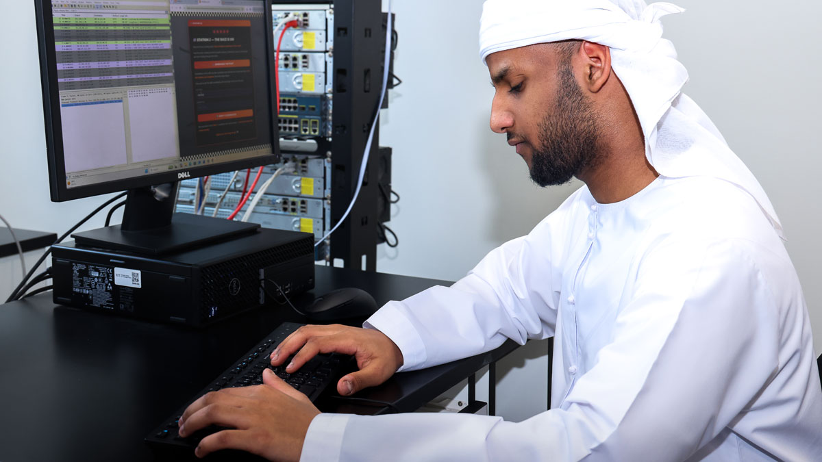 RIT student working on a computer