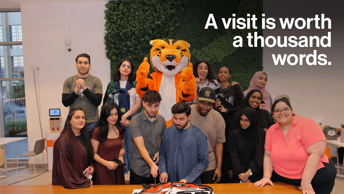 Students cutting cake