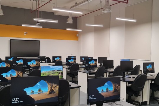 Computer lab with many windows desktop computers
