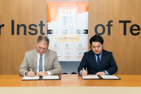 RIT Dubai VP Academics and Corpy & Co. CEO signing an MOU