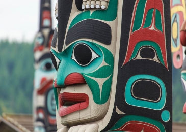 wooden totem poles colorfully painted