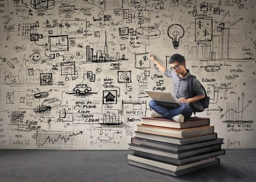 a person sitting on top of a stack of books using a laptop. The background is filled with hand drawn doodles and ideas