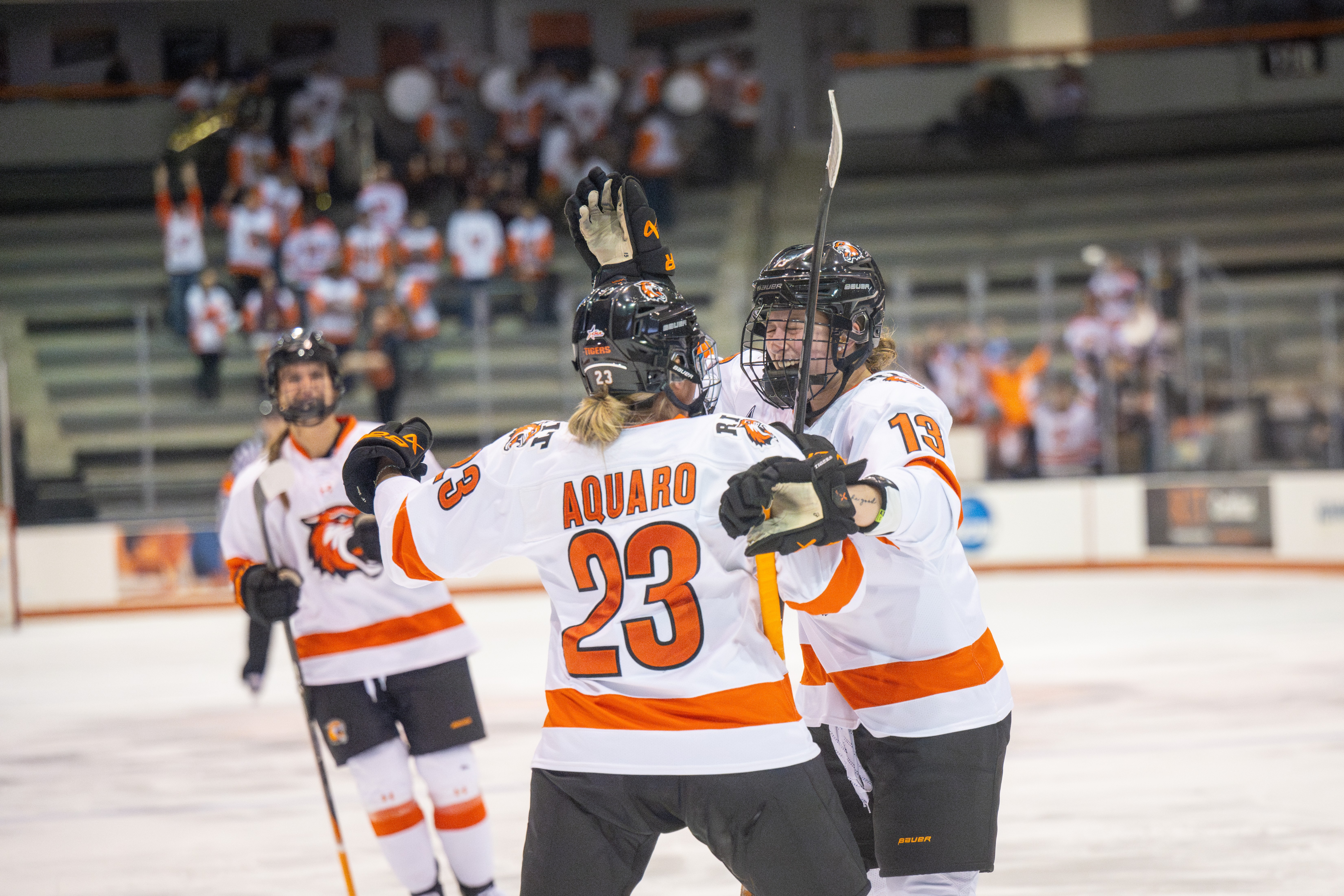 Women's Hockey players playing on the field
