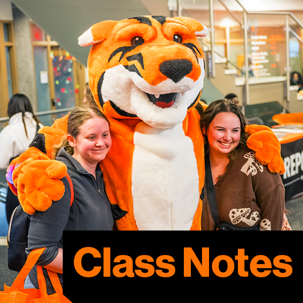 Ritchie posing with two girls for a picture with text class notes written below on orange background
