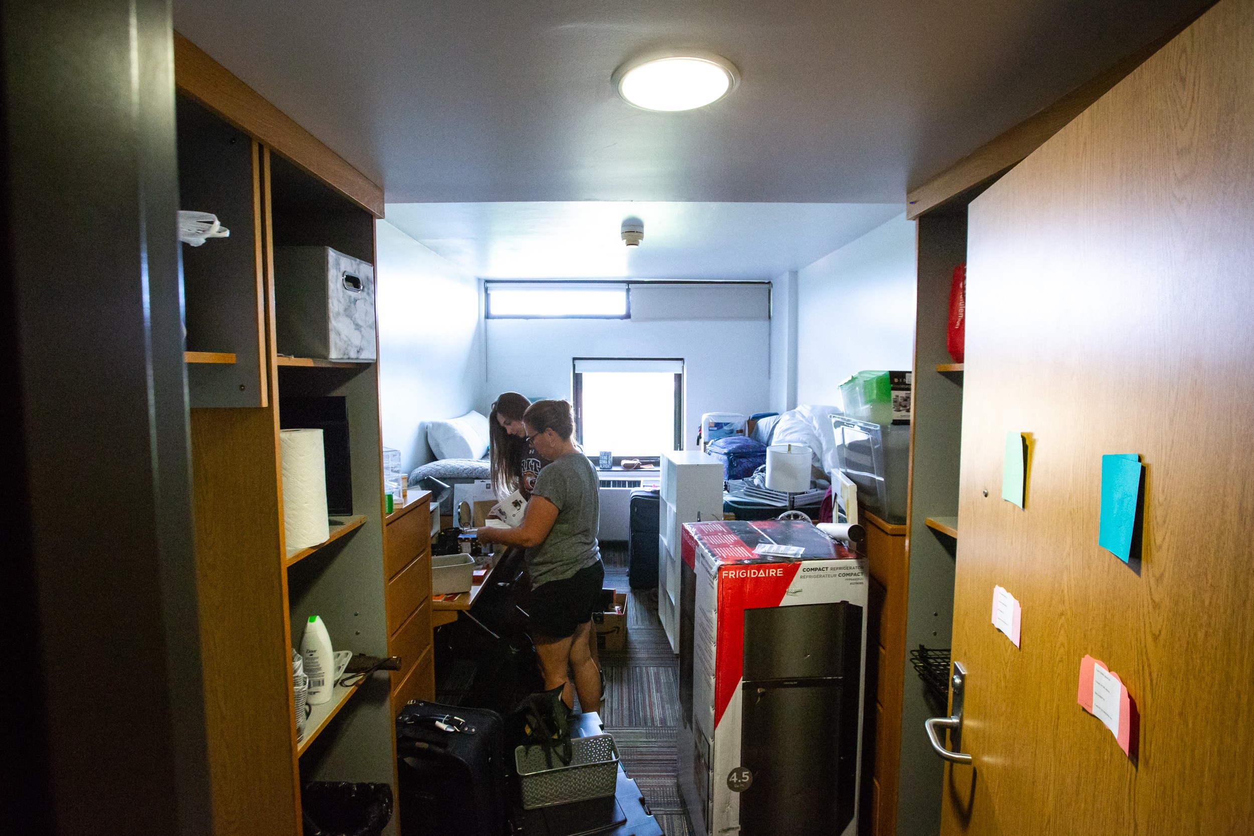 Student unpacking and moving into an RIT dorm room