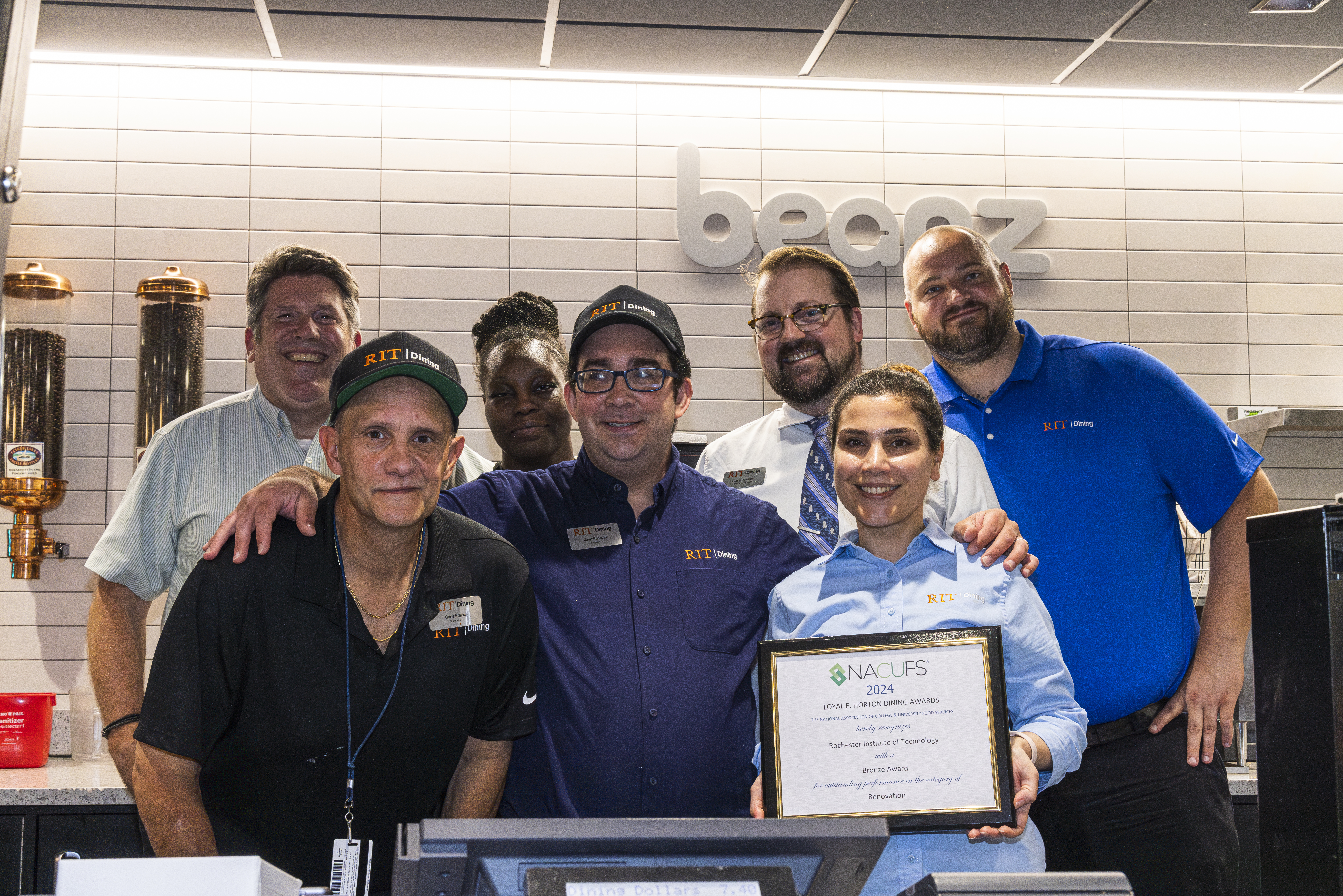 RIT Dining accepting Beanz renovation of the year award at the NACUFS conference