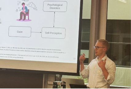 Calvin Nau presenting his research talk.