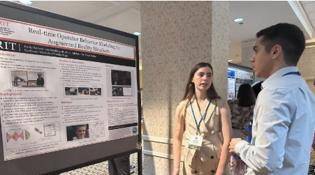 Photo of Emily Rooney presenting her research poster.