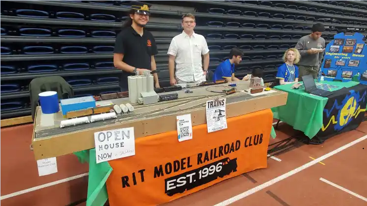 The RIT Model Railroad Club's layout module with a working railyard, powered trains with lights and sounds, and handmade, custom-painted models in HO scale!
