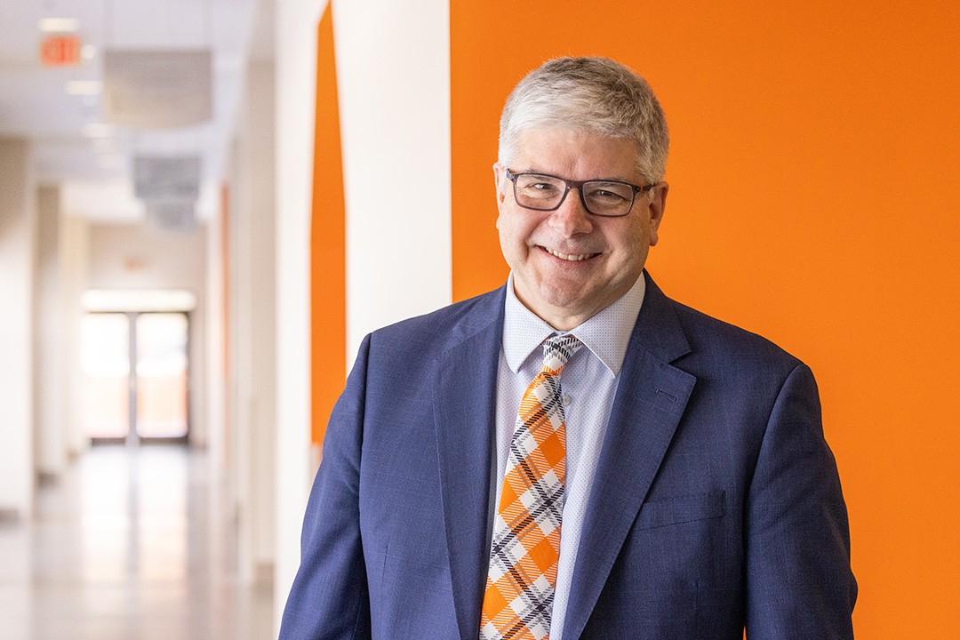 RIT’s 11th president, William Sanders standing in the hallway
