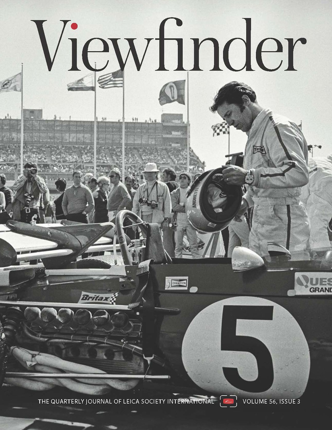 Black and white photo of a race car driver.