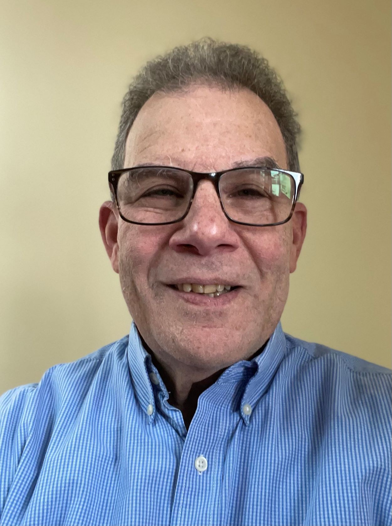 Student wearing his Ph.D. cap and gown.