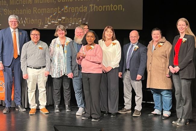 The Courseleaf Catalogue Implementation Team, pictured here with RIT President Bill Sanders, left, was one of the winners of the 2026 Presidential Awards for Outstanding Staff.