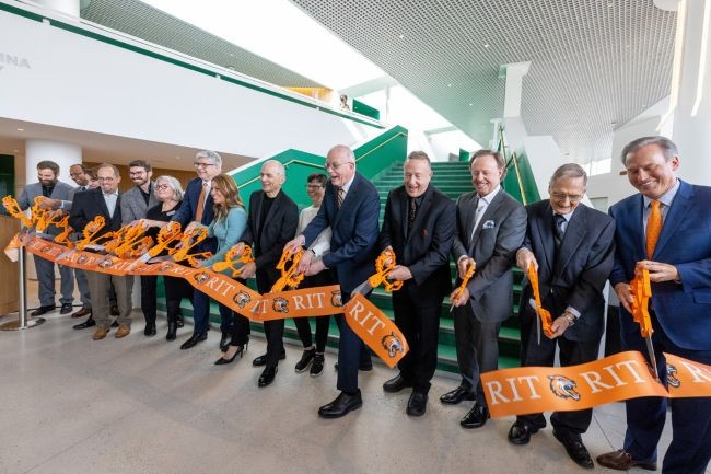 School administrators, donors, faculty, staff, students, and architect Michael Maltzan cut the ribbon to officially open the RIT Performing Arts Center, which will provide more practice and performing venues for RIT students.