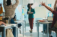 Students, throw paper and celebration in classroom with teacher, success and achievement at university. College professor, men and women with exam documents, test results and goals with education