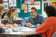 teachers collaborating in a faculty meeting