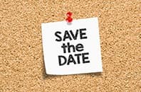 Save the date. Save the date written on sticky note pinned on cork notice board.