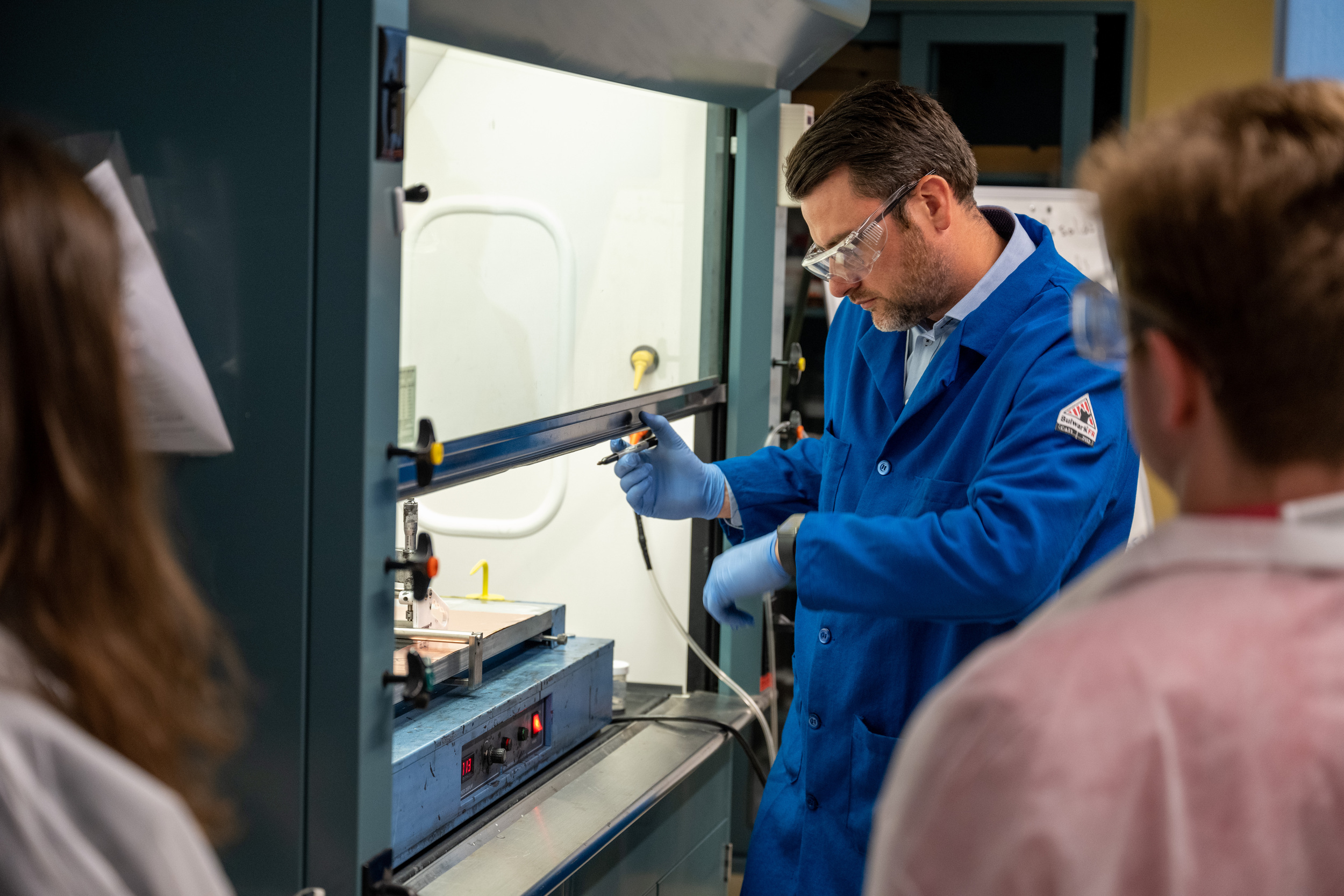 A professor demonstrating in the Battery Prototype Center.