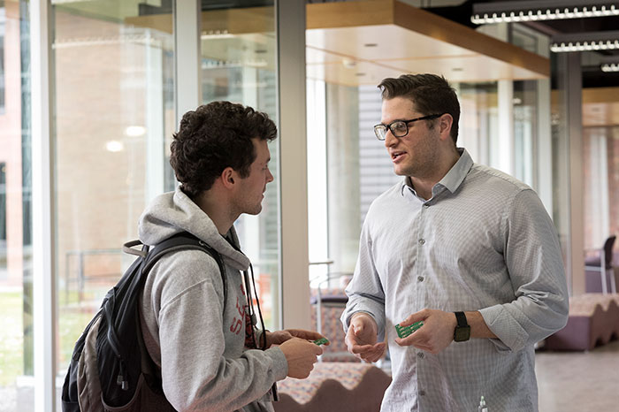 a student speaking with a professional
