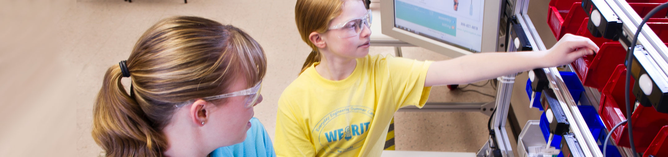 2 female students wearing protective eyewear