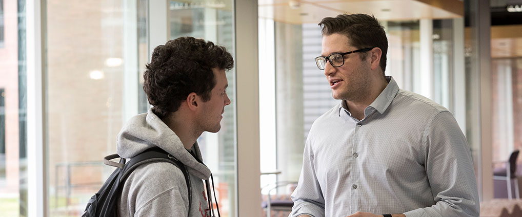 a student speaking with a professional