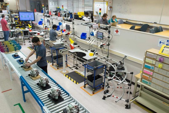 Students working on an assembly line