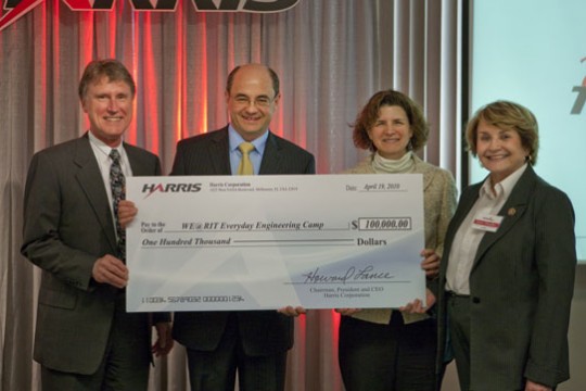 People holding award at event