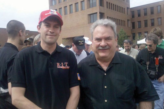 People posing for camera at event