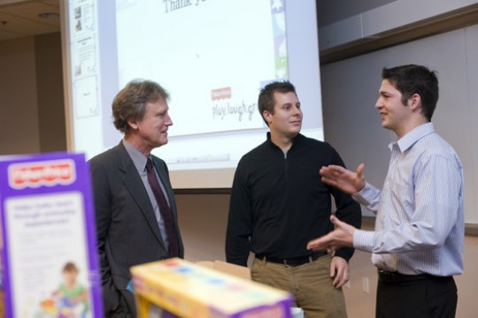 People talking at the front of classroom