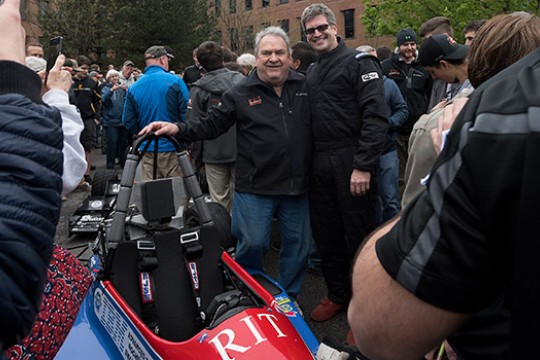 RIT professors posing with Formula Car 