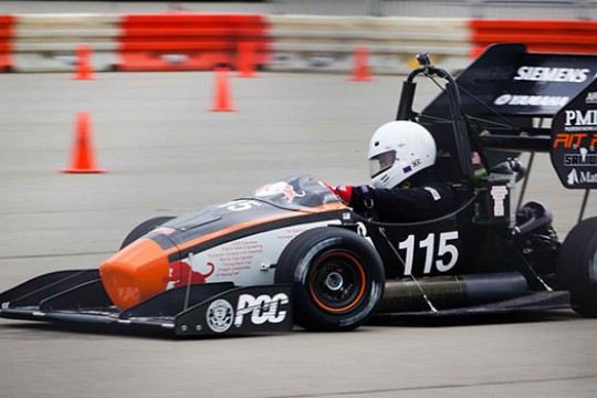 Person racing formula car